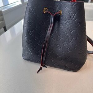 Louis bag in navy with red velvet in mint condition. Firm price.